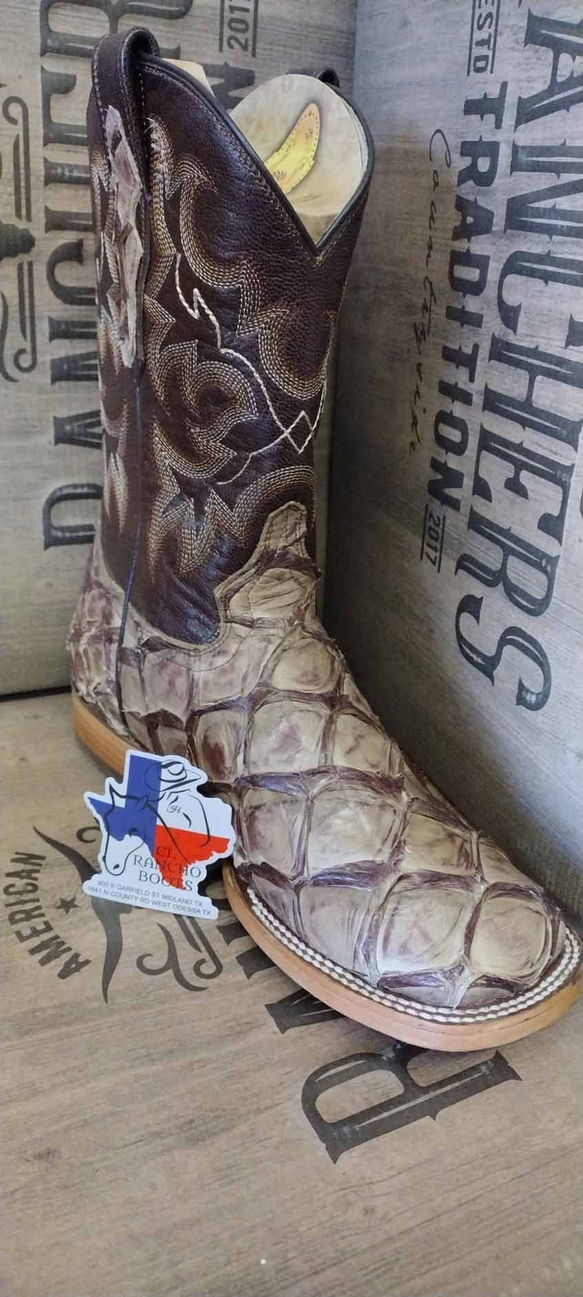 Brown and tan cowboy boot with a patriotic Texas star, displayed against a western-themed background