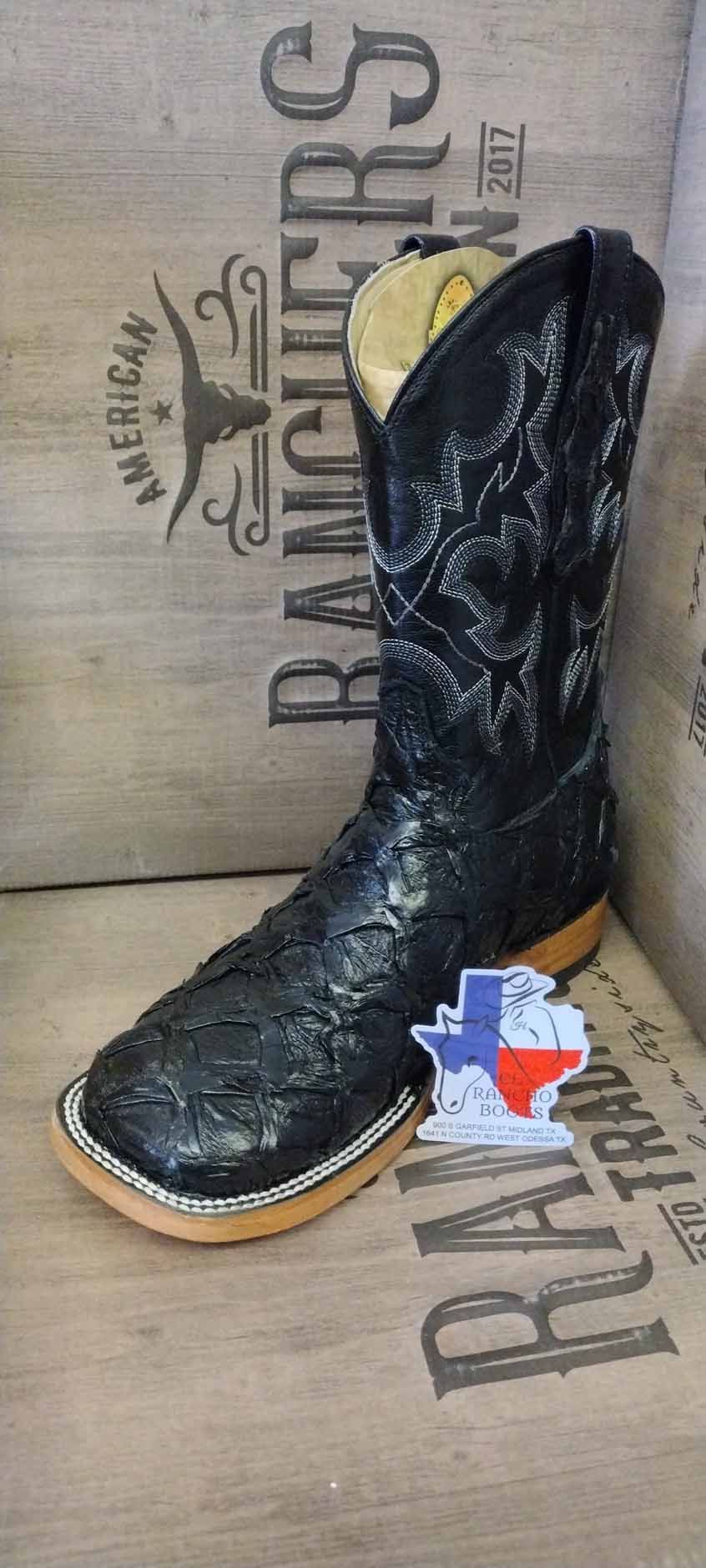 Black knee-high boot on cardboard box with RAANGERS text and small Texas graphic