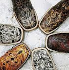 Assorted decorated shoes with intricate patterns arranged in a circle on a white background