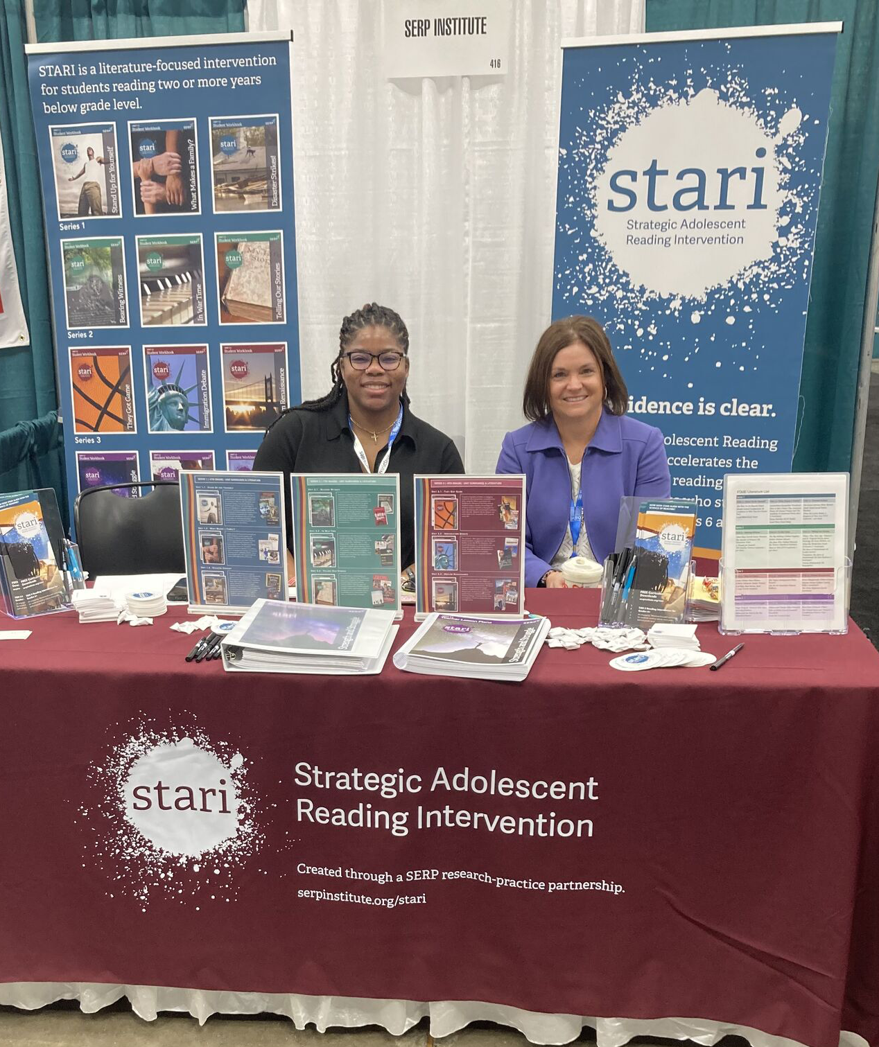 Two women at a booth with 