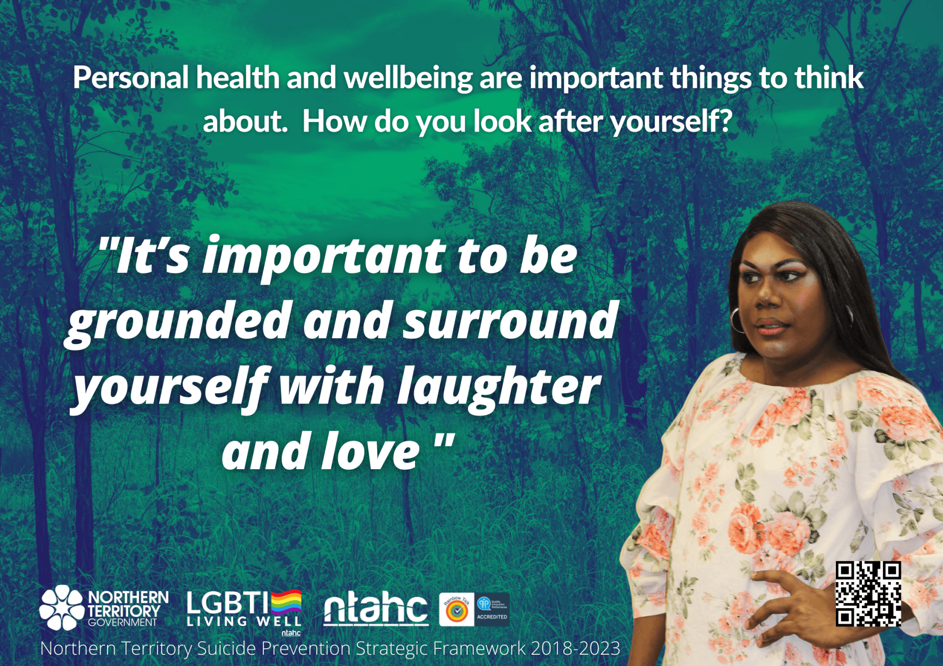 A woman is standing in front of a quote about personal health and wellbeing
