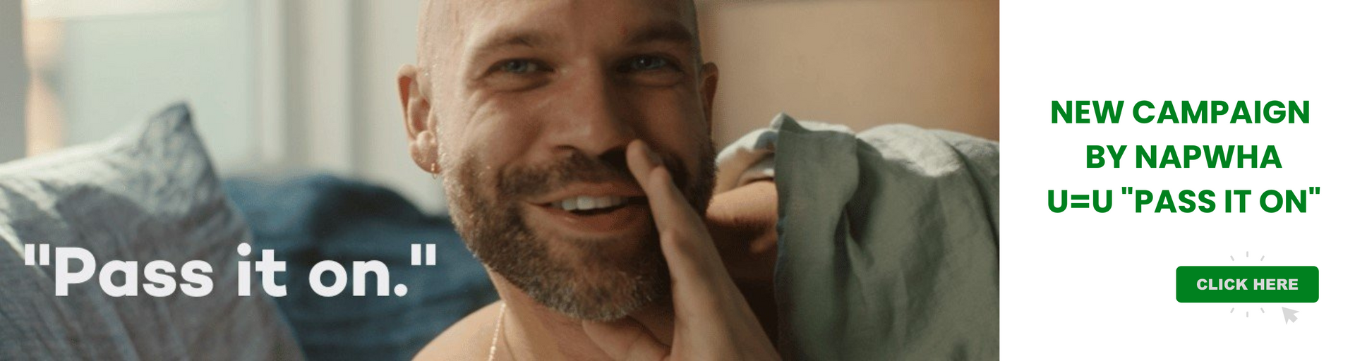 A man with a beard is sitting on a couch with his hand on his nose.