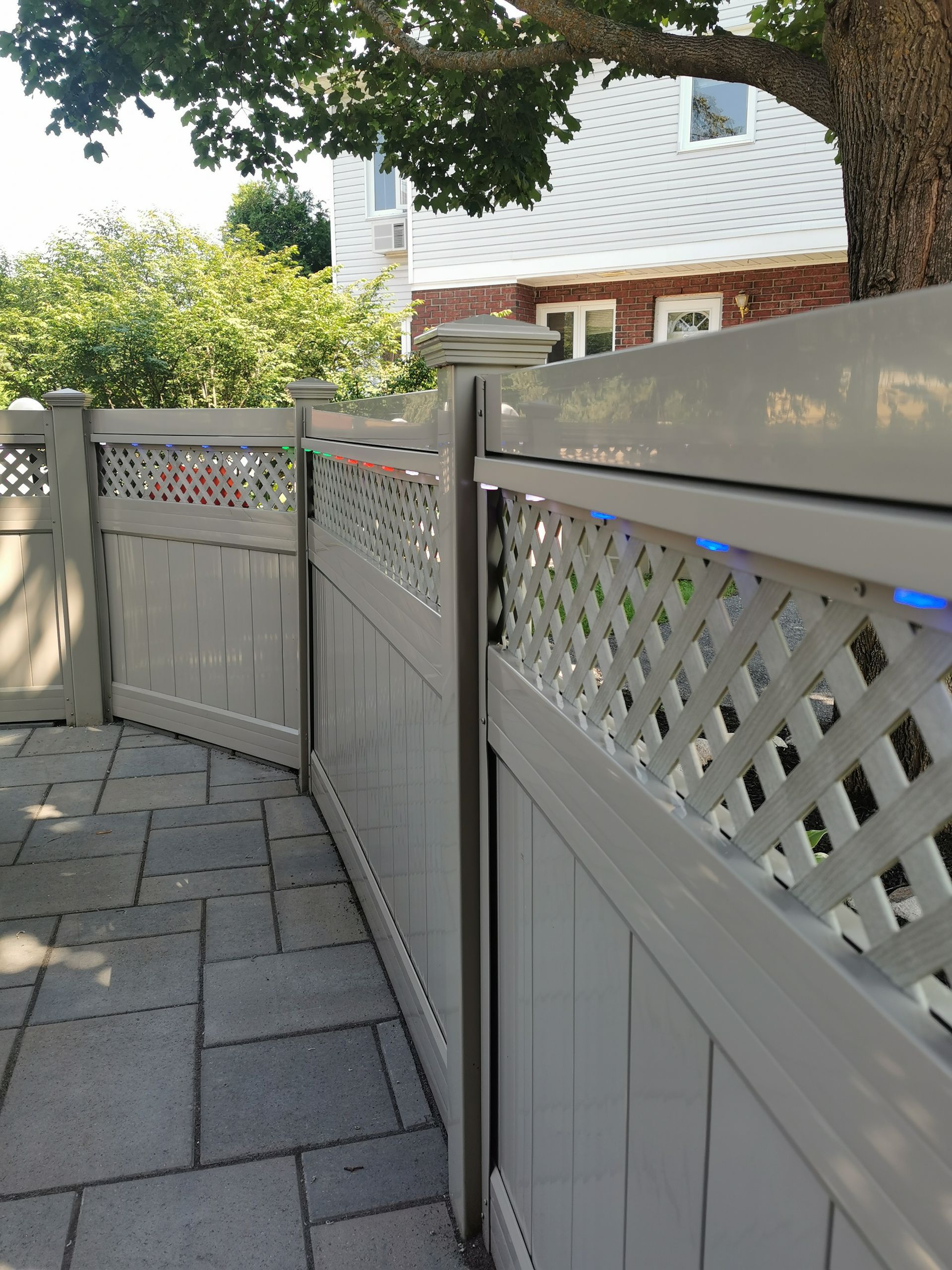 A white wooden fence with a lattice design
