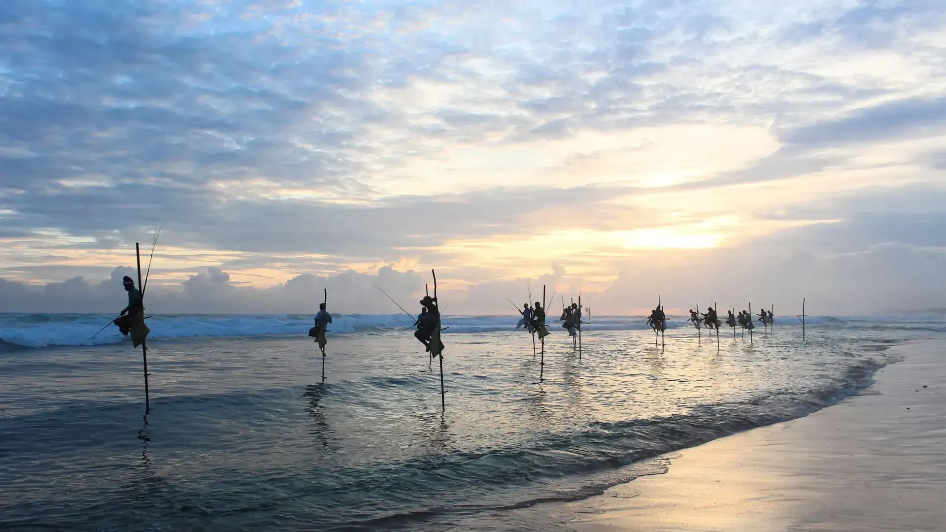 Locals-Fishing-and-Balancing-On-Sticks-In-the-Sea.