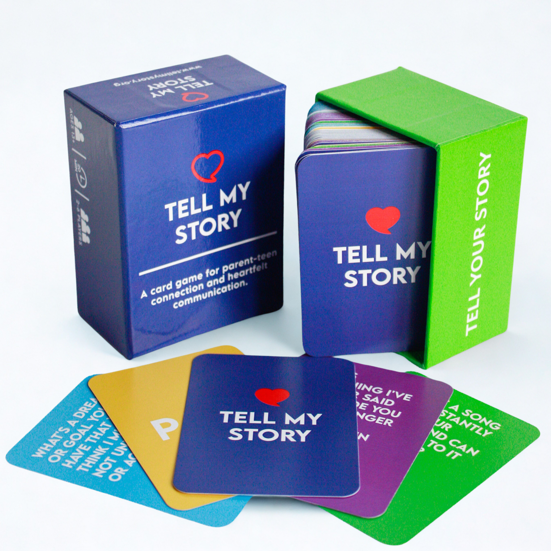 Colorful “Tell My Story” card deck boxes and cards displayed on a white background