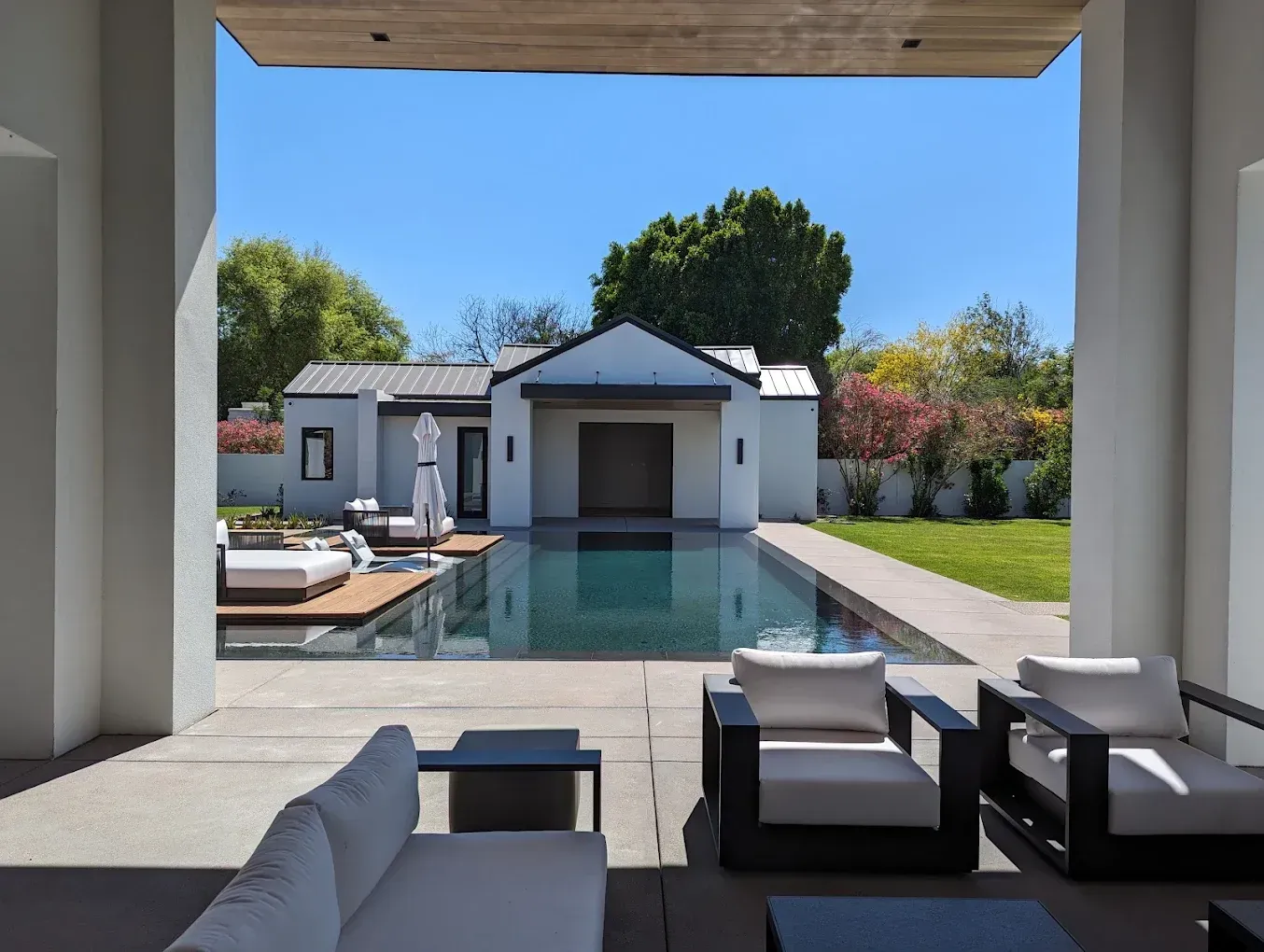 A house with a large swimming pool in the backyard