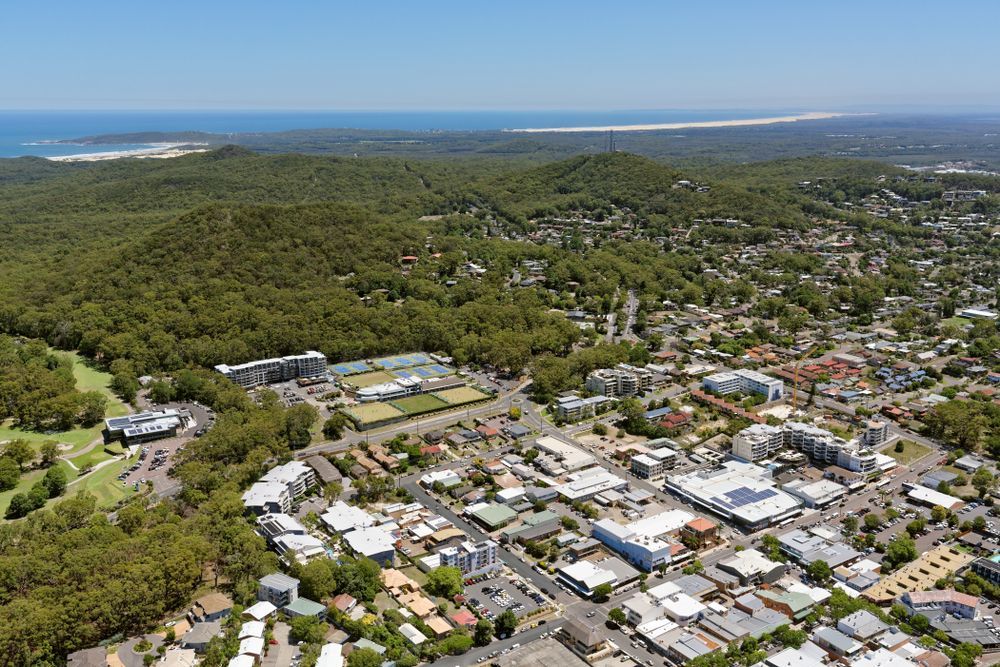 An Aerial View Of A Small Town Surrounded By Trees And Buildings — Port Stephens Removals & Storage In Nelson Bay, NSW