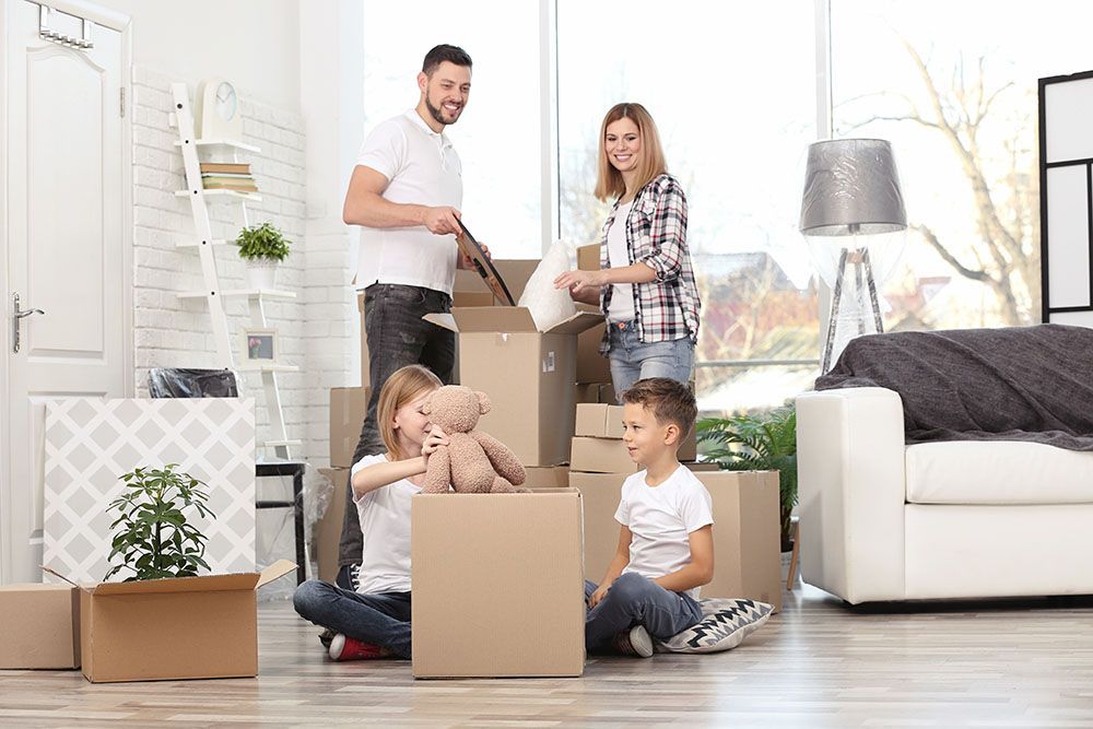 A Family is Moving Into a New Home — Port Stephens Removals & Storage In Salt Ash, NSW