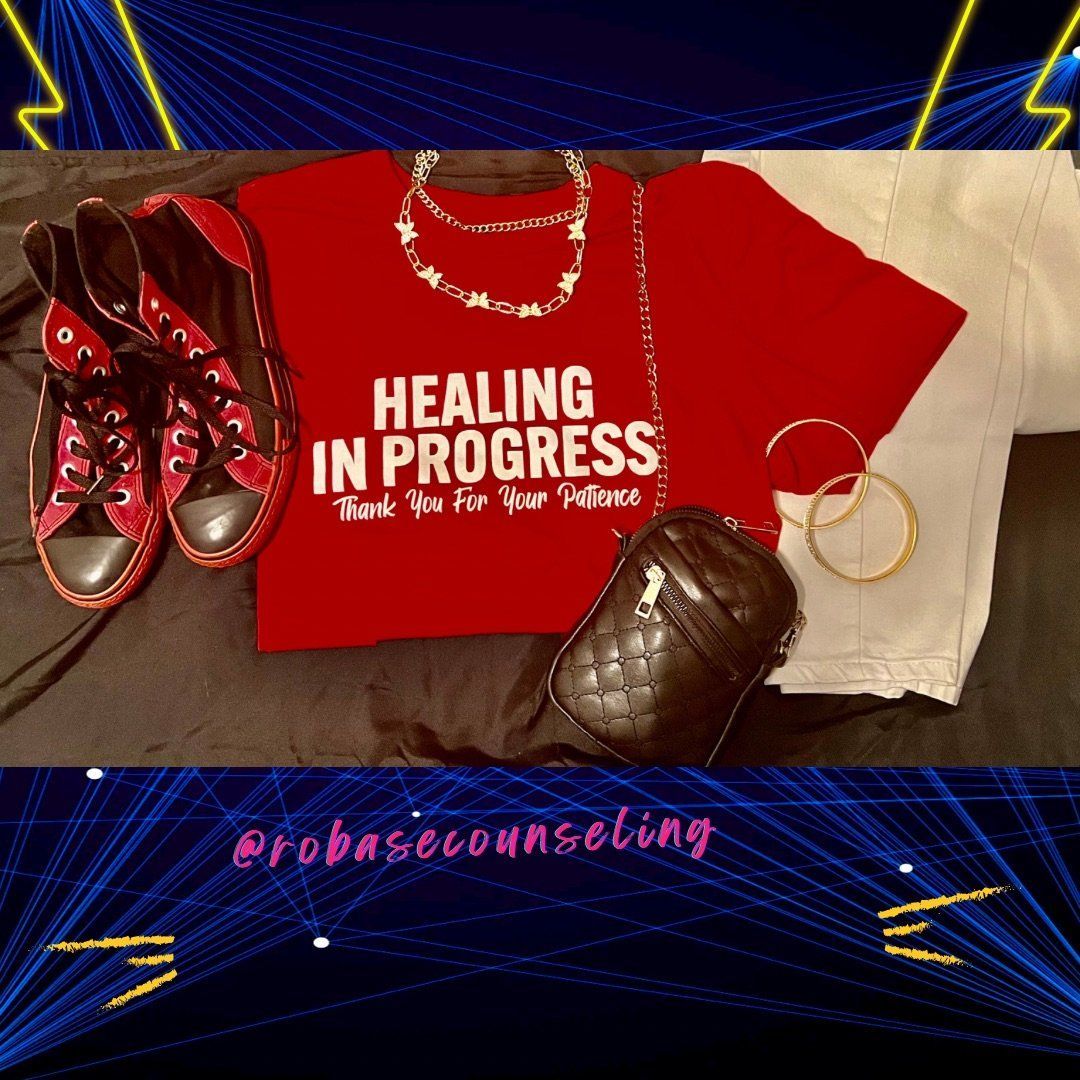 A red shirt that says healing in progress on it