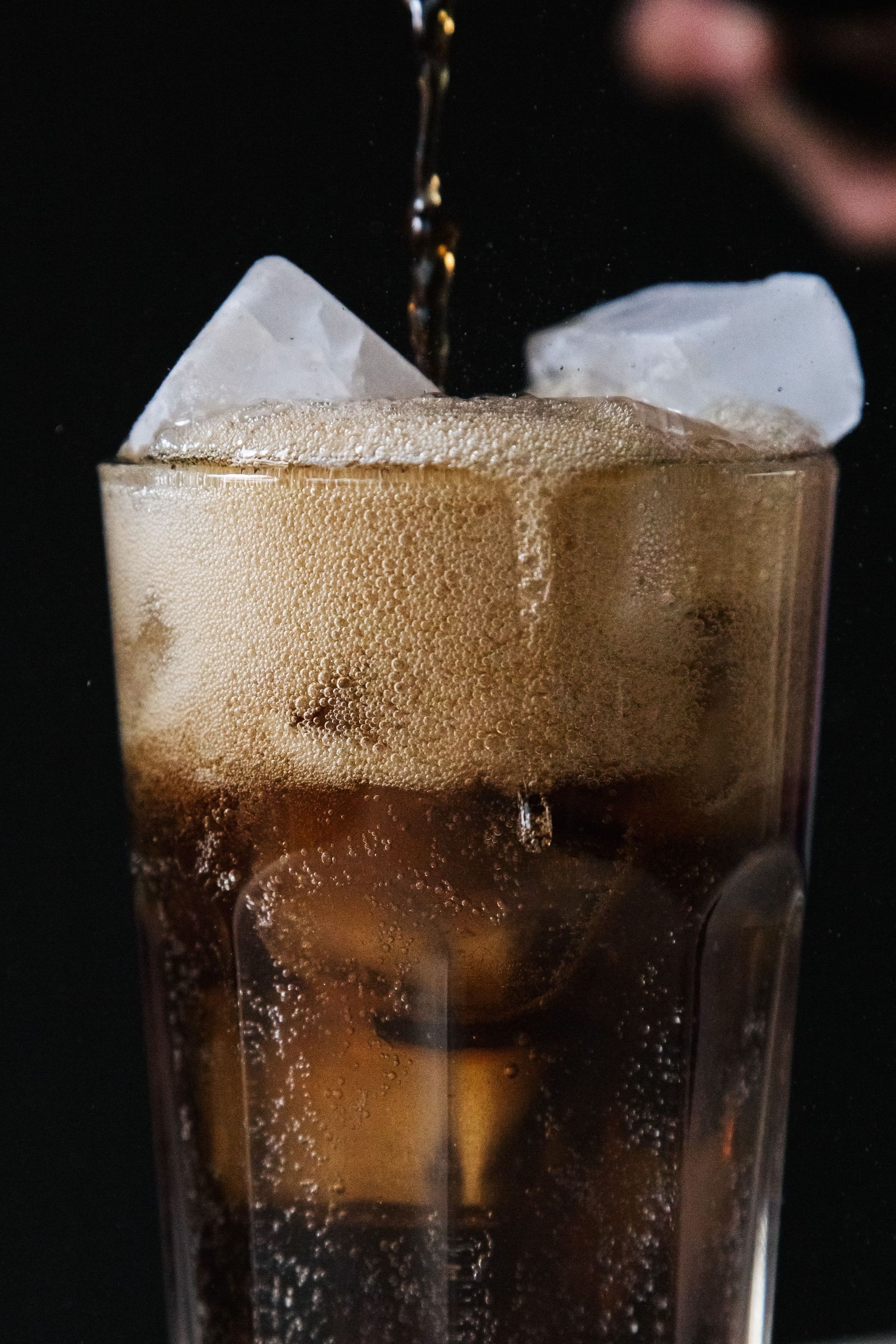A glass of soda with ice