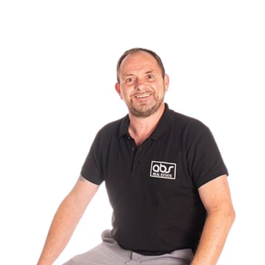 A man wearing a black shirt that says obs on it