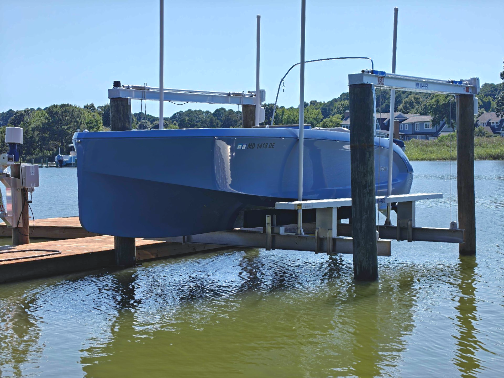 RAND Mana 23' ft picnic boat periwinkle on boat lift