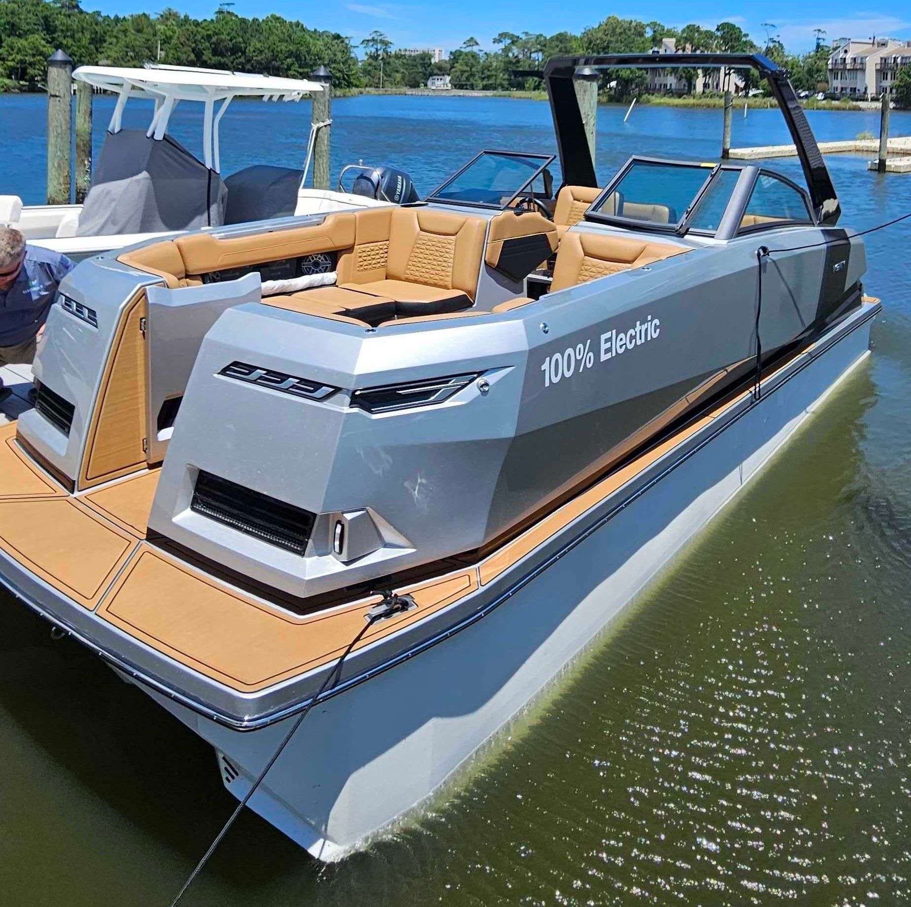 Ingenity boat with 2 ladies on the back transom