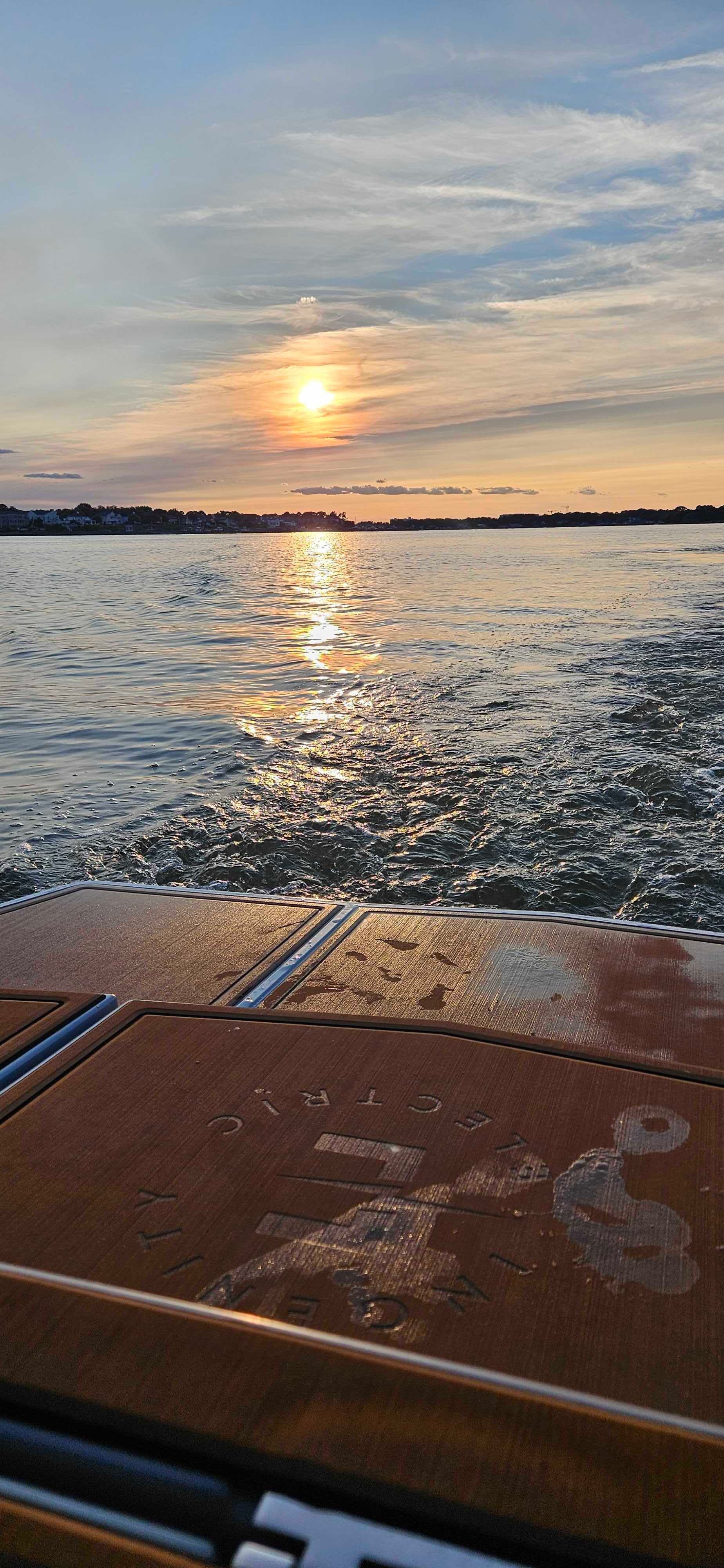 The sun is setting over a body of water.