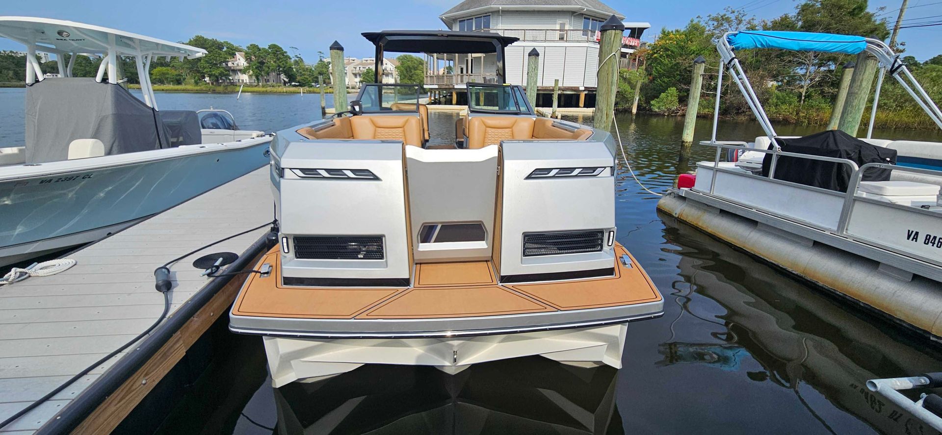 A boat is docked at a dock in the water.