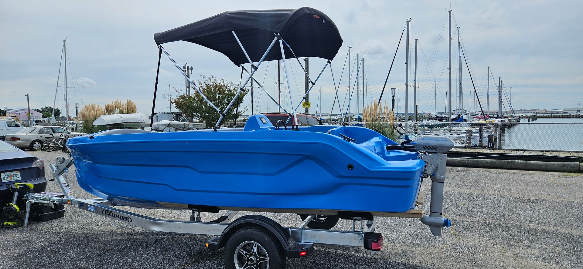 Blue plastic boat sitting on trailer