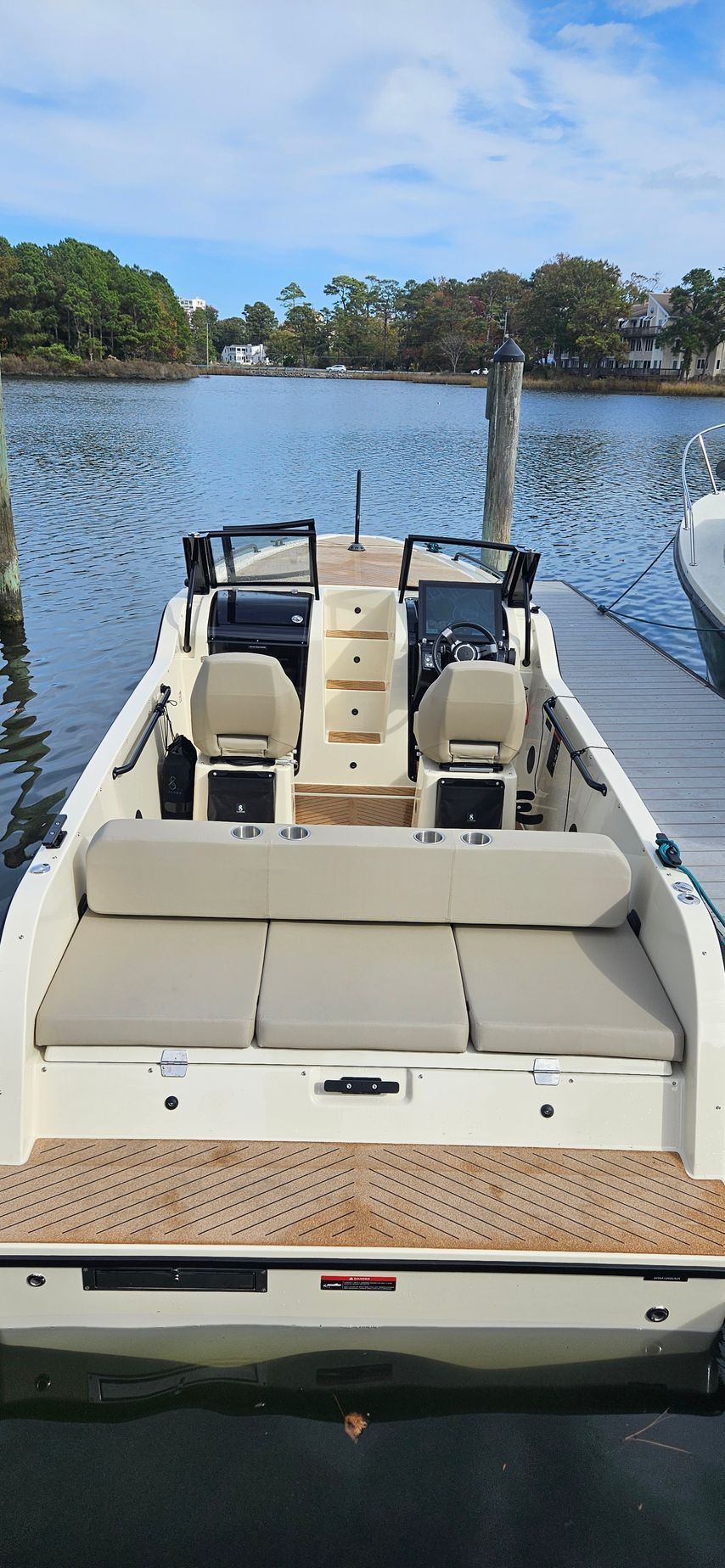 A boat is docked at a dock in the water.