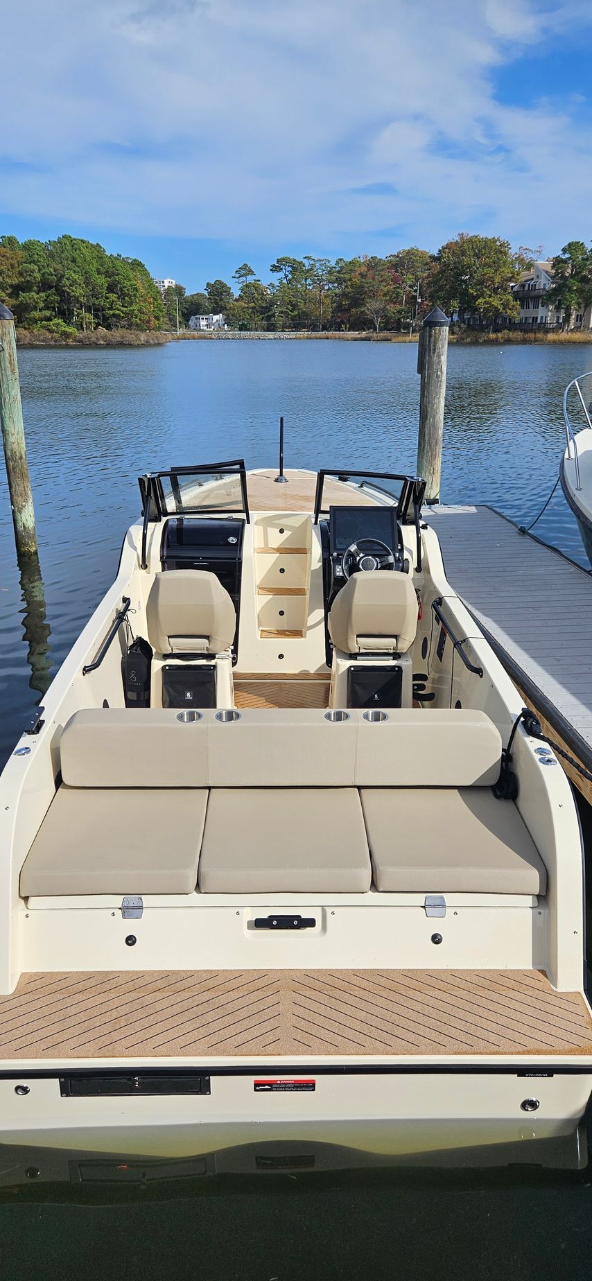 A boat is docked at a dock in the water.