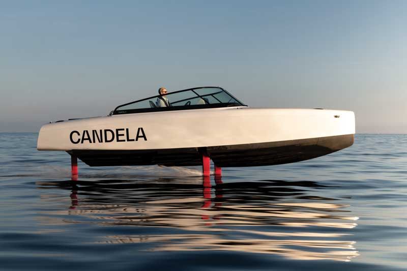 A Candela on the side is floating on top of a body of water.