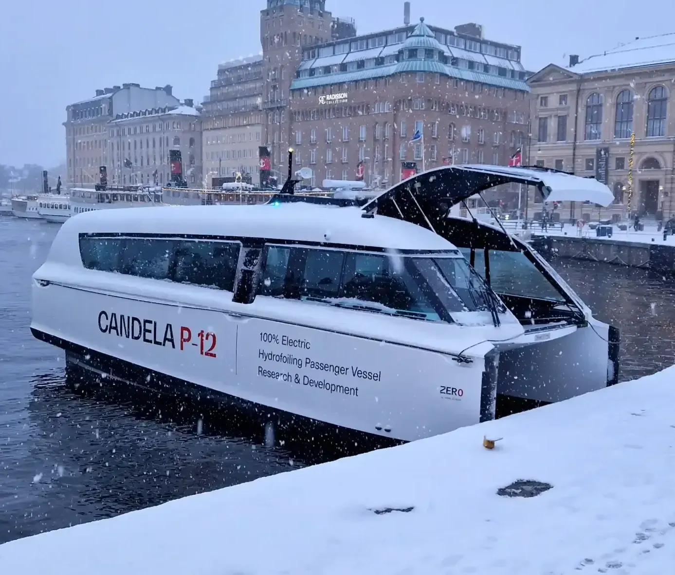 A white boat with the word candela on it