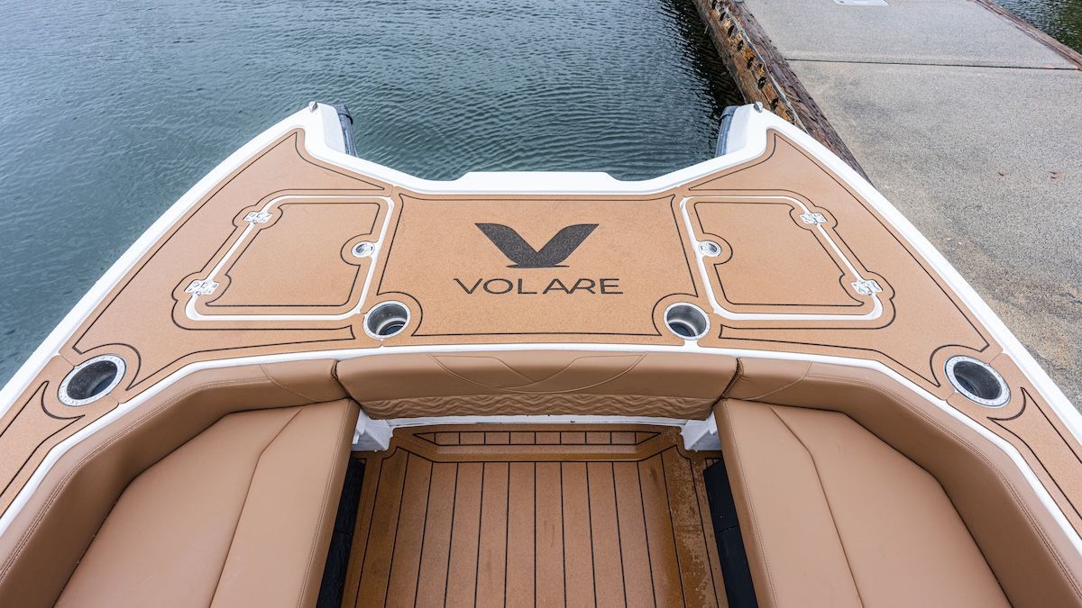 Front (bow) of the Artemis23 from Volare Boats Light Brown interior Volare logo on front of boat catamaran hull 