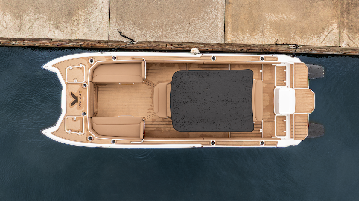 Bow of the artemis23' in water from birds eye view, electric boat