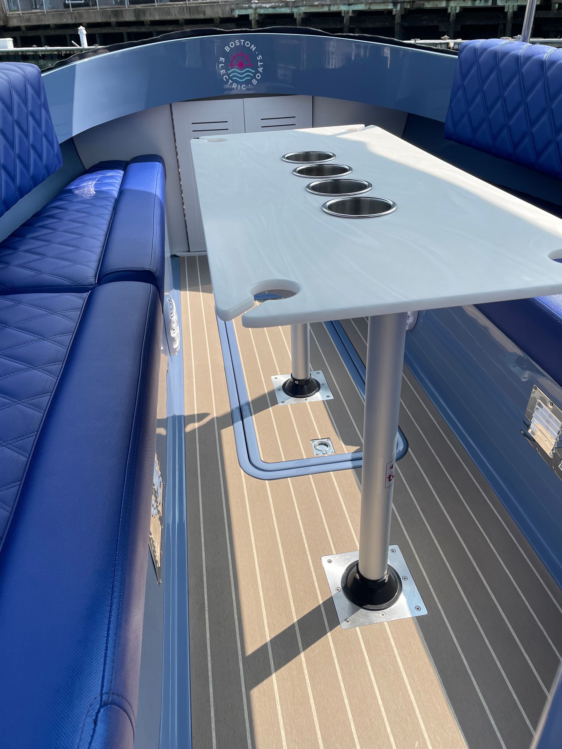 upclose white table on picnic boat fantail 217 blue interior 