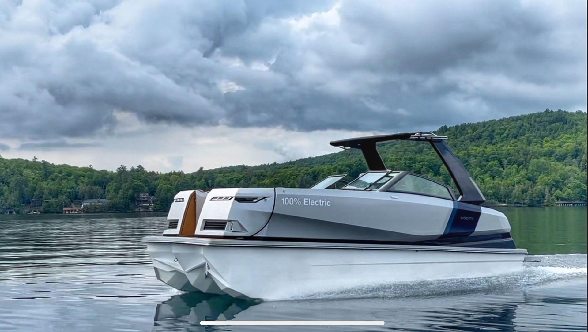 A gray and white trimaran boat cutting through the water