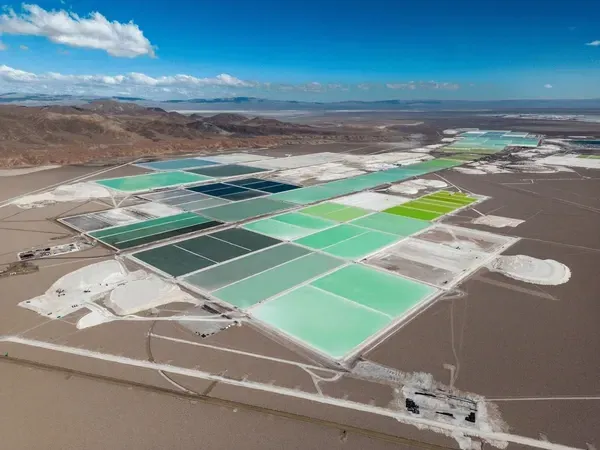 An aerial view of a large salt lake in the desert.