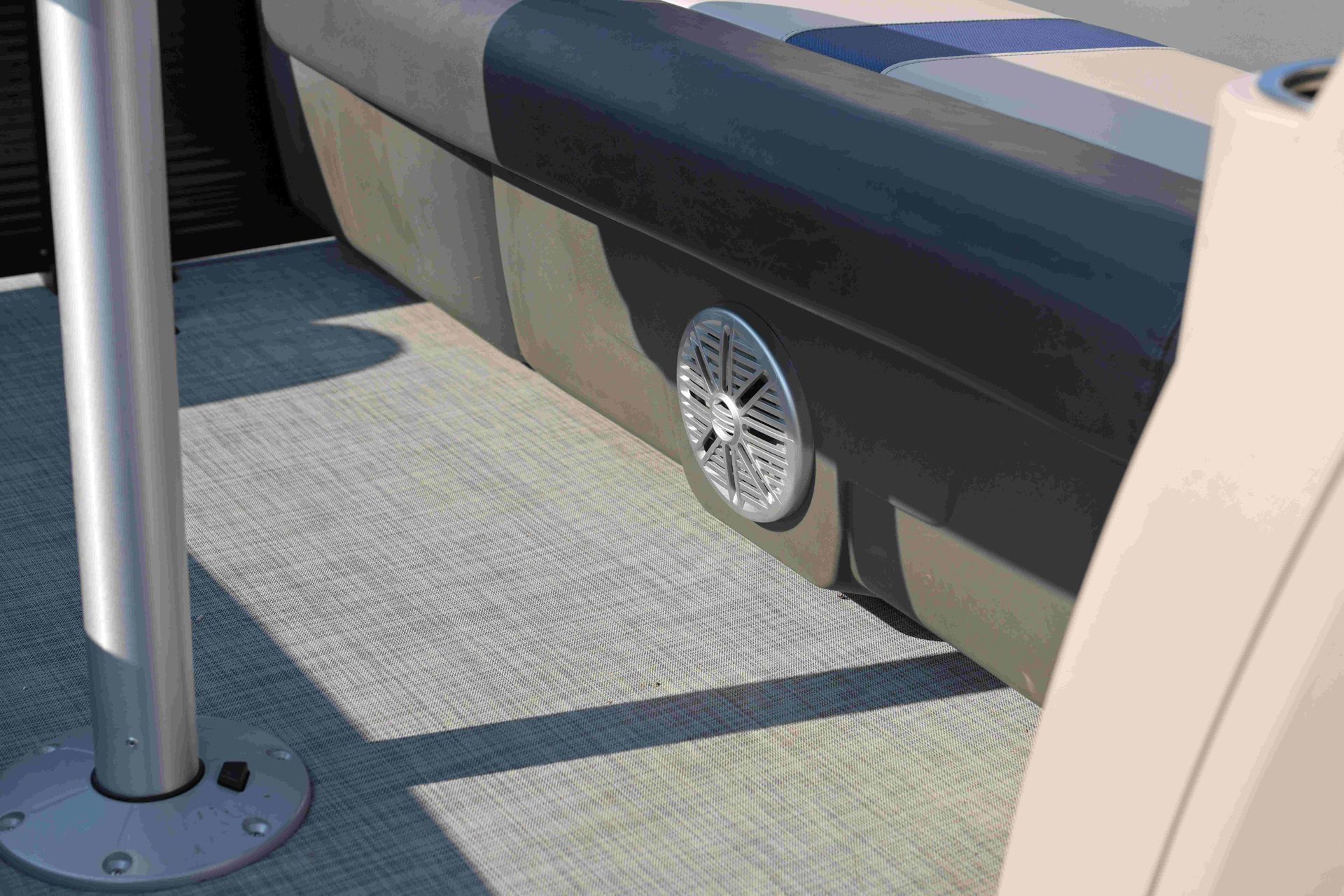 speaker on bottom of bench/sofa on a boat with texture decking
