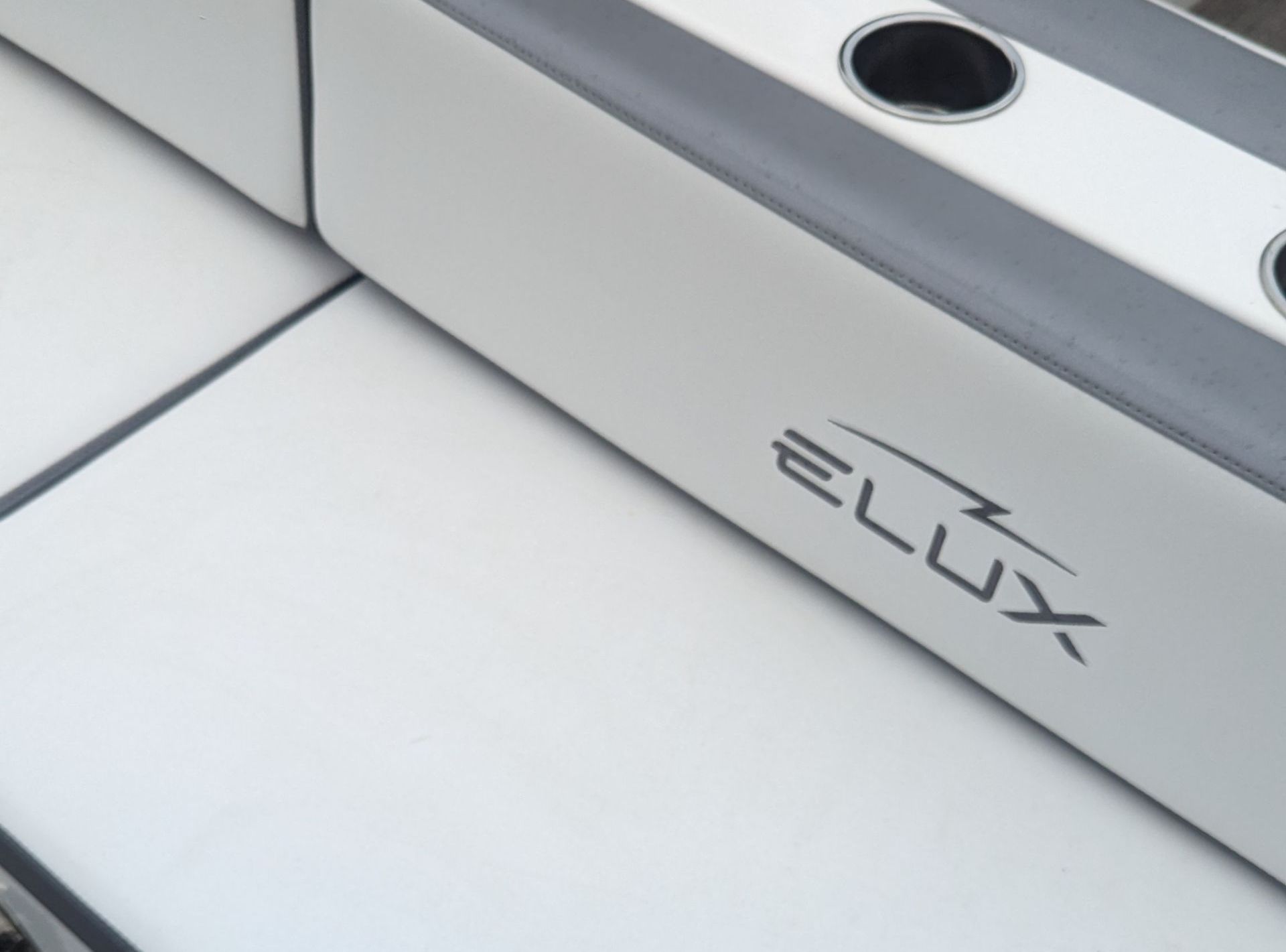 The word elux is on the side of a boat