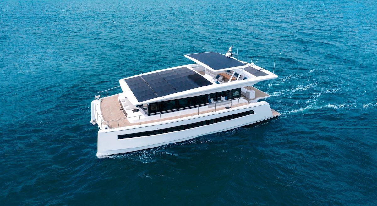 Blue scout dorado speed through water bow rider in front of island/inlet