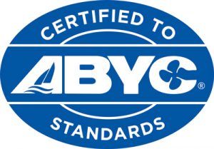 A blue and white logo that says certified to abyc standards