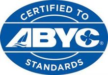A blue and white logo that says certified to abyc standards