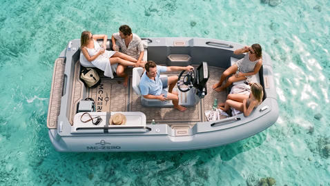 ariel view of family on large tender in water turquoise blue  