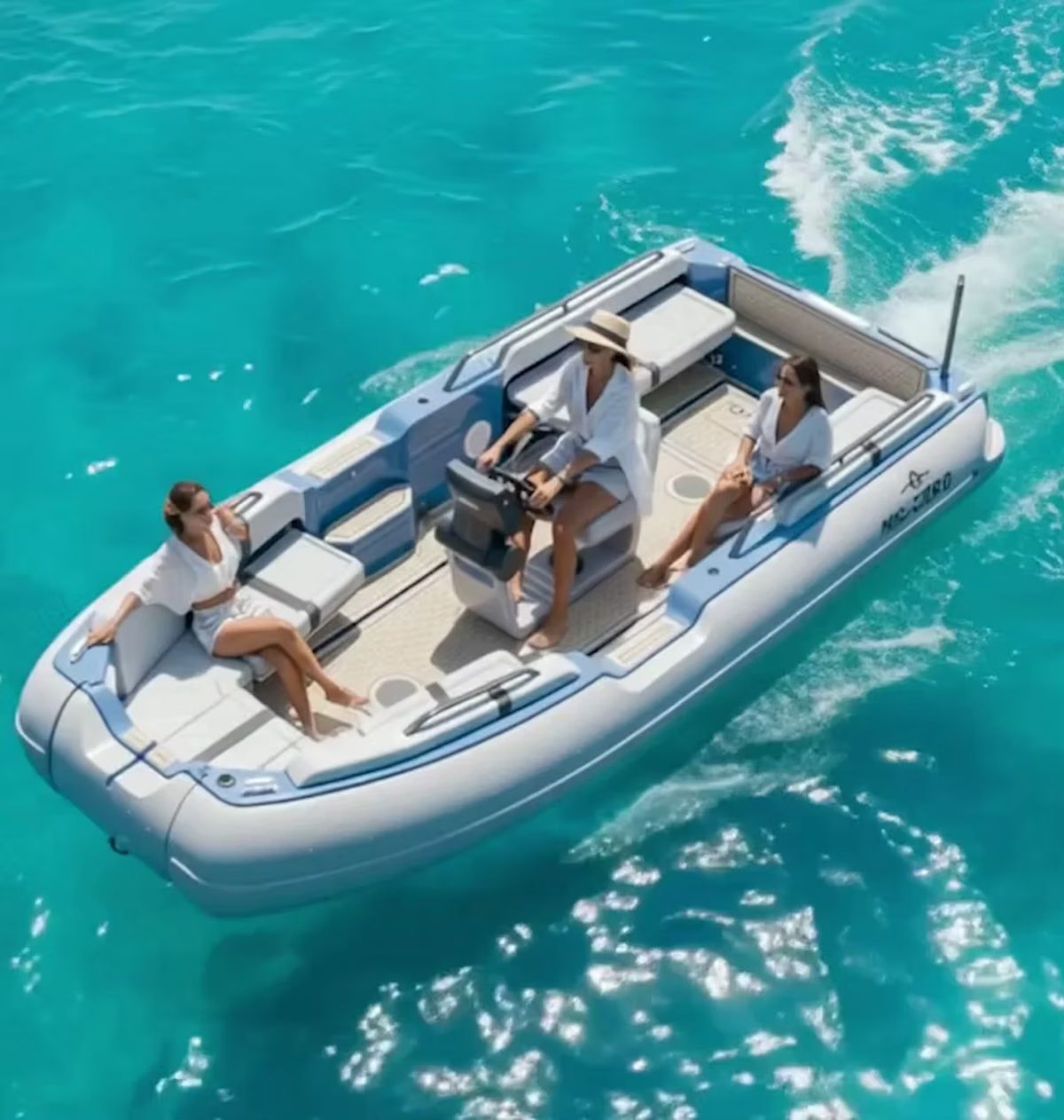 Female riding the ZeroJet Powered OC tender in the ocean