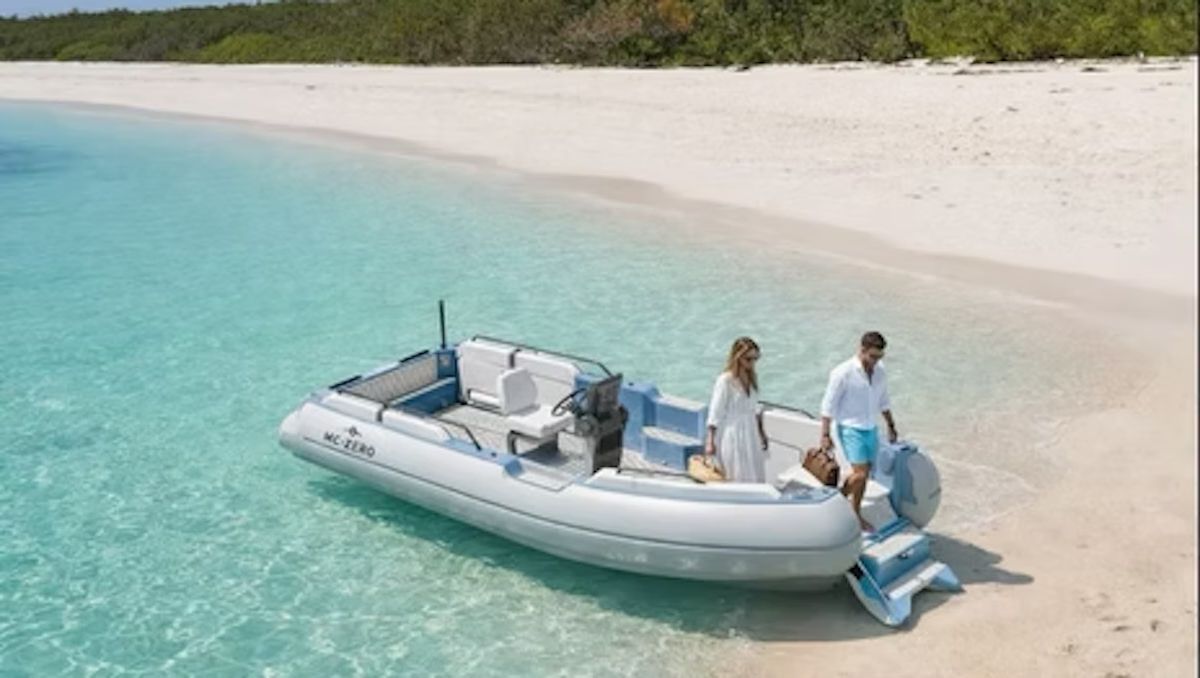 Couples riding the ZeroJet Powered OC tender in the ocean