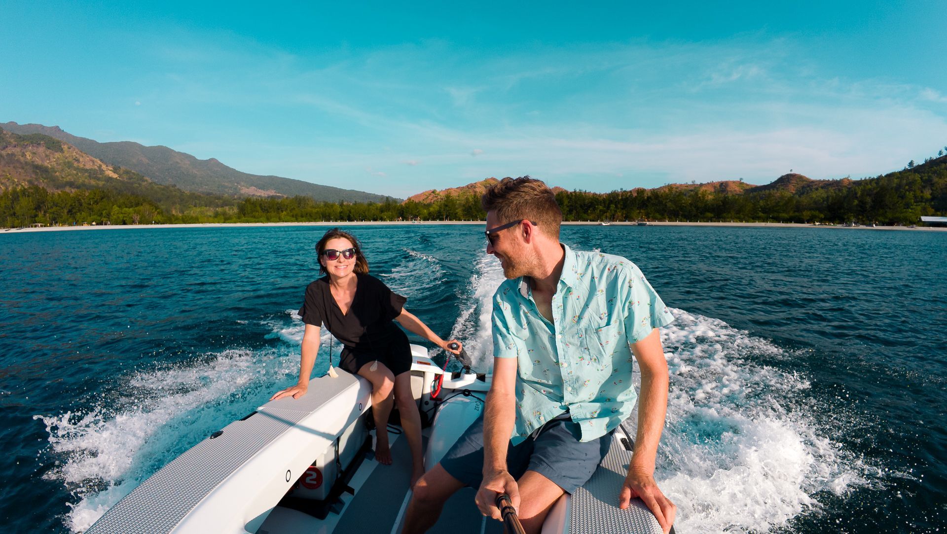 Couples riding the ZeroJet Powered OC tender in the ocean