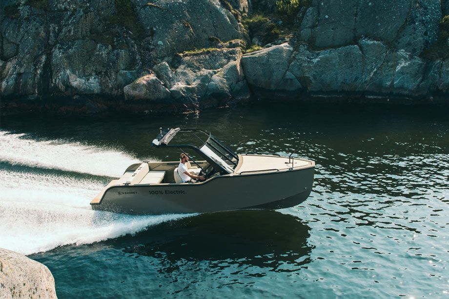 A boat is floating on top of a body of water.