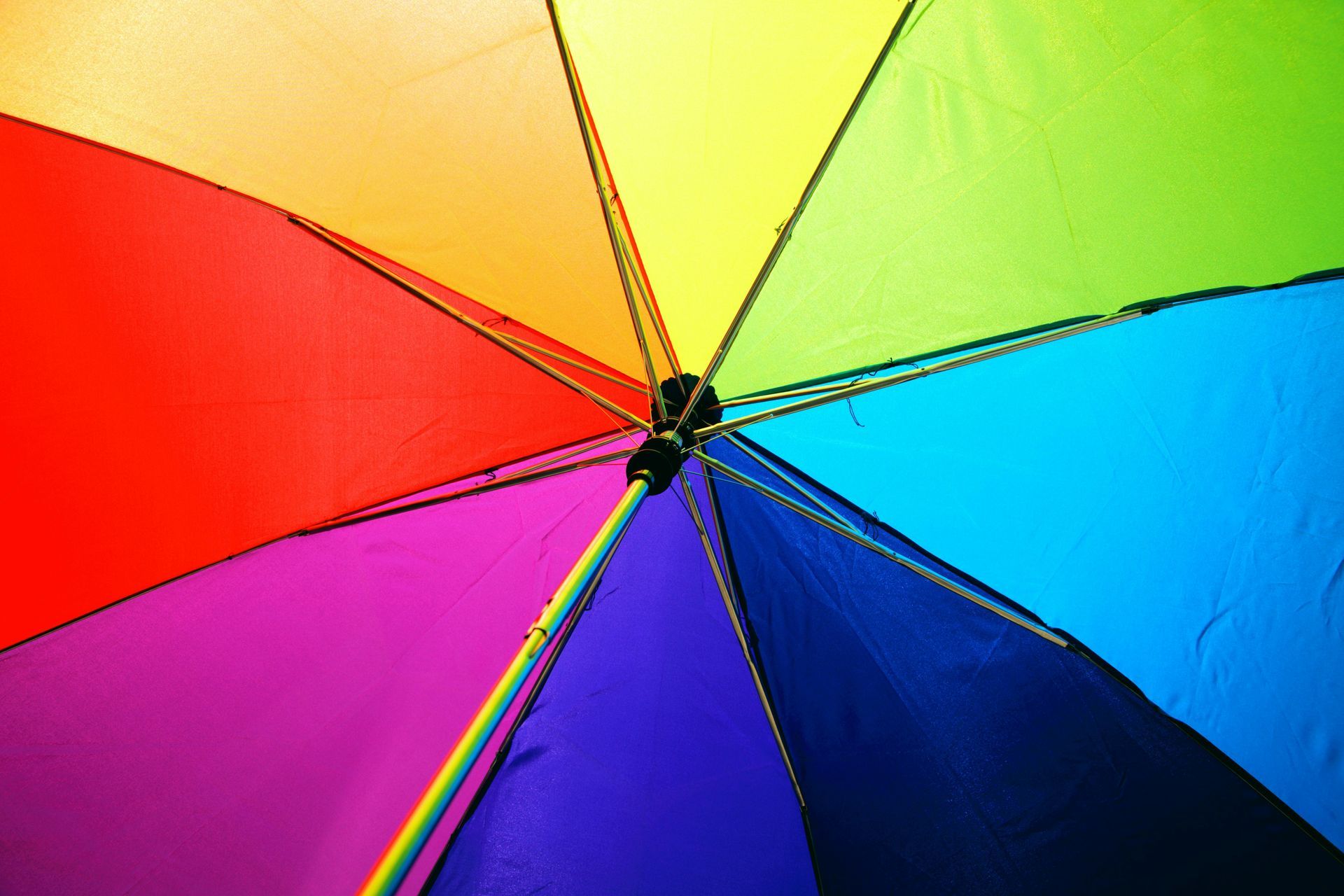 Rainbow-colored umbrella opened