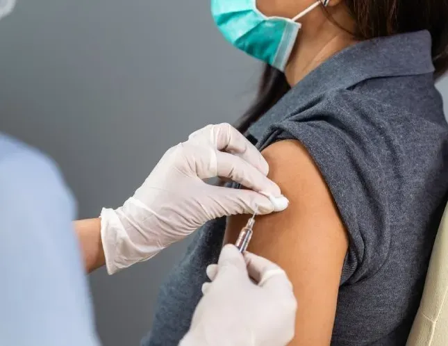 Woman Receiving Vaccinations