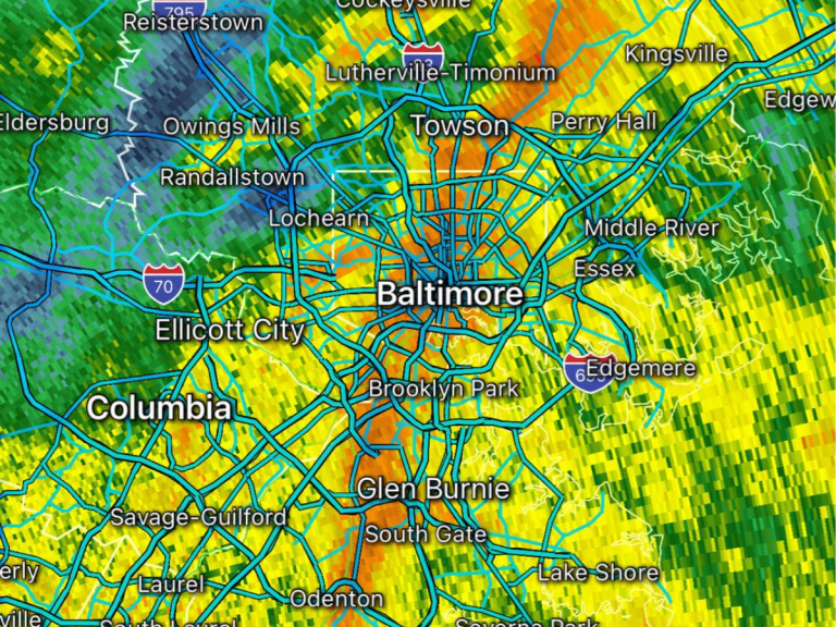 Radar map of Baltimore, Maryland, showing rainfall intensity in green and yellow with city names overlaid.