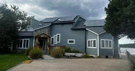 Asphalt shingle roof and gutter installation on a residential home in Maryland.