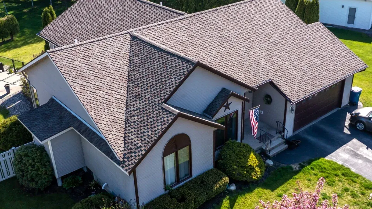 Asphalt shingle roofing installation on multi-gabled suburban home in Maryland