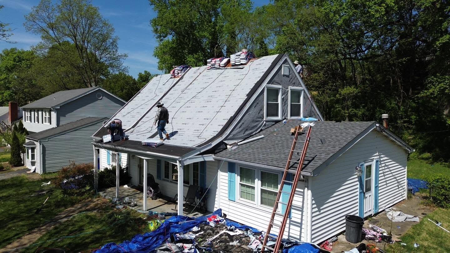 Residential roof with porch and addition sections completed by Vanguard General Contracting