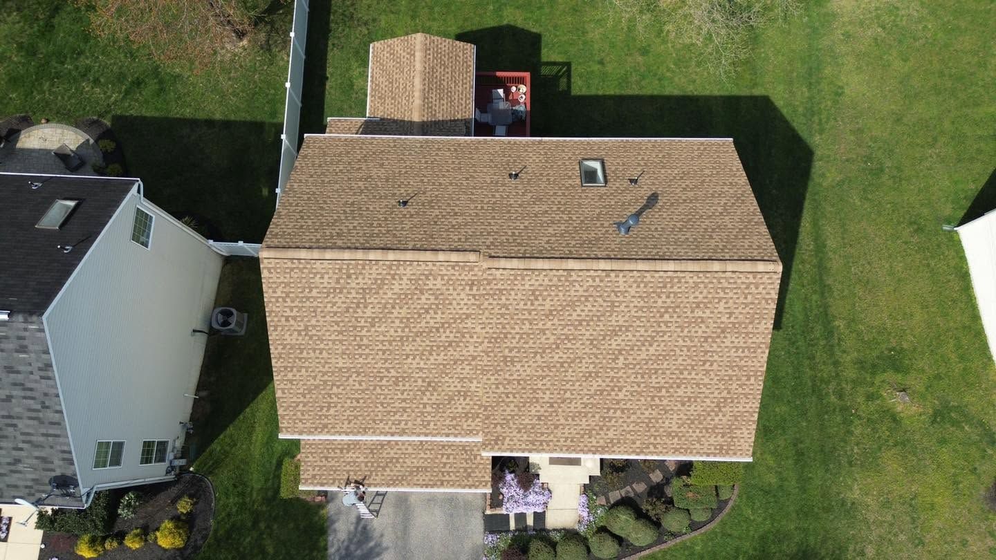 Residential roof area illustrating roof penetrations that may need flashing or boot repair