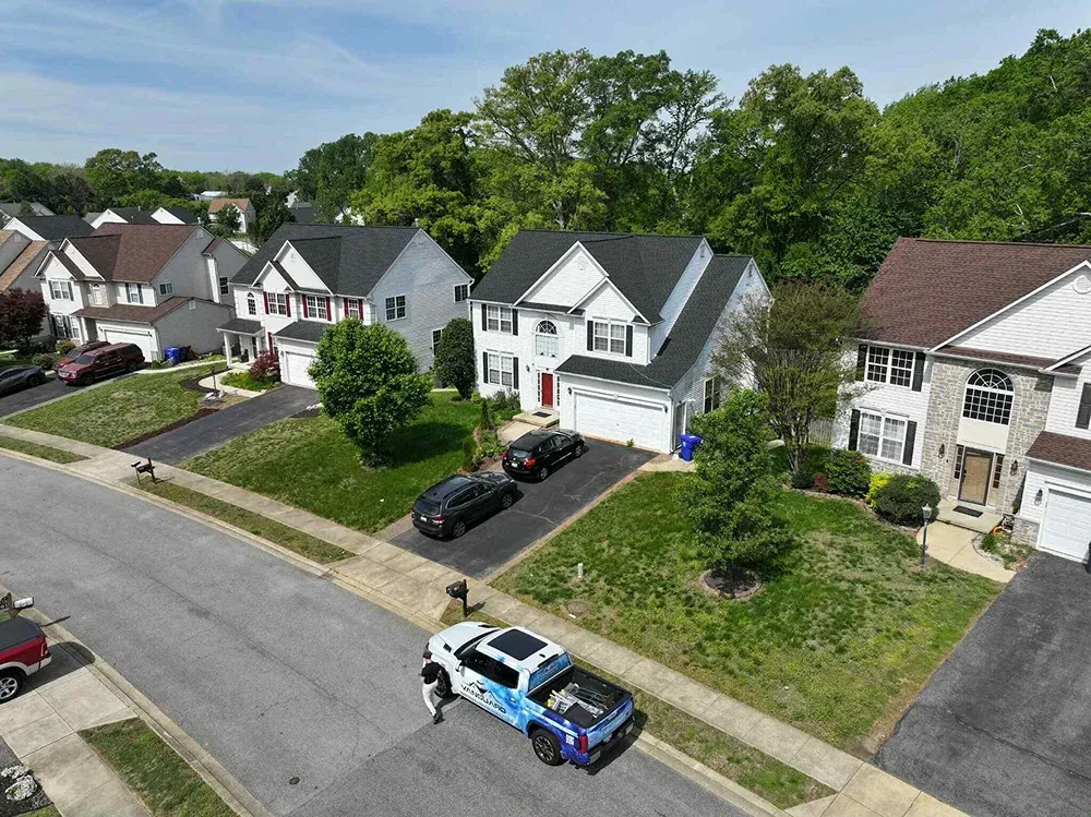 Asphalt shingle roof installations on residential homes in Maryland.