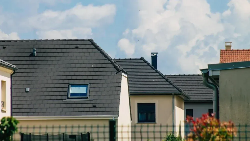 sloped tiled roof installation on modern residential homes in Maryland