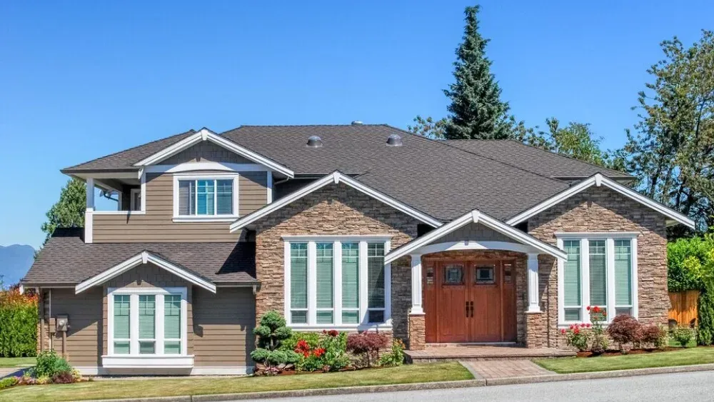 Asphalt shingle roof installation on two-story suburban home in Maryland