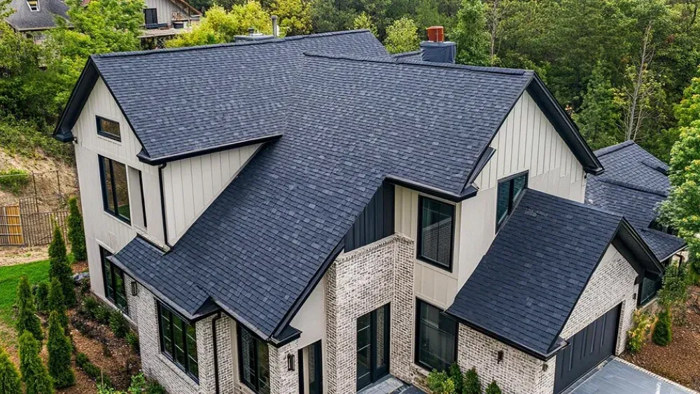 Asphalt shingle roof installation on modern two-story residential home in Maryland